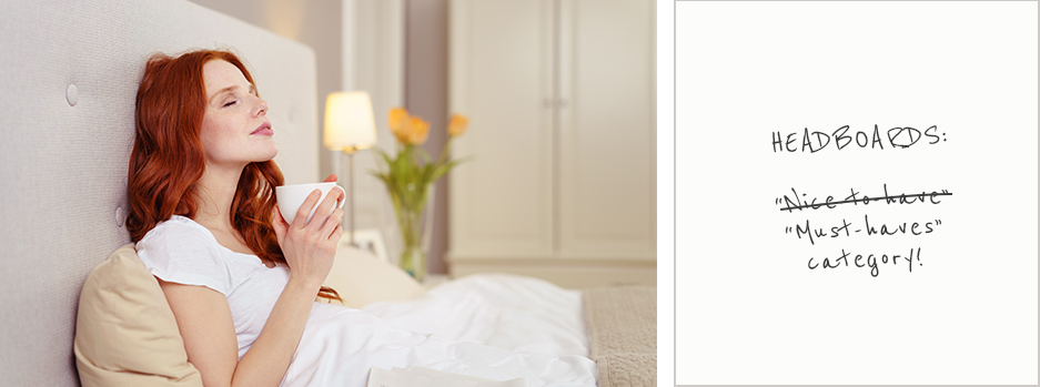 Red haired lady sitting in bed with head leaning against light grey headboard enjoying a cup of tea